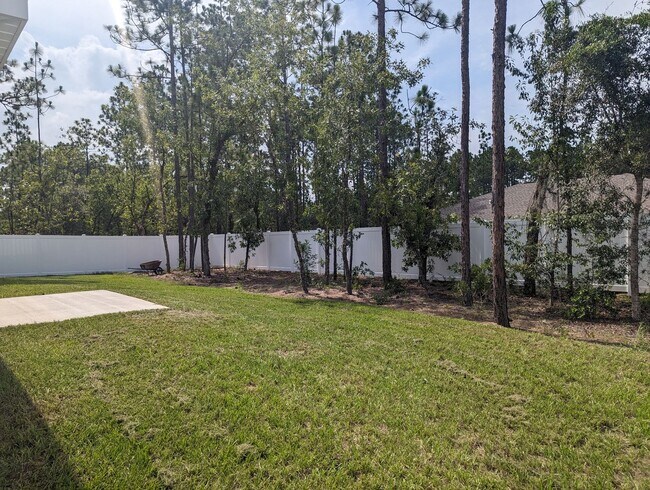Building Photo - New 3/2/2 fenced home with Many Upgrades i...