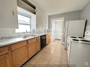 Building Photo - The Perfect 4-bedroom, 2-bathroom house lo...