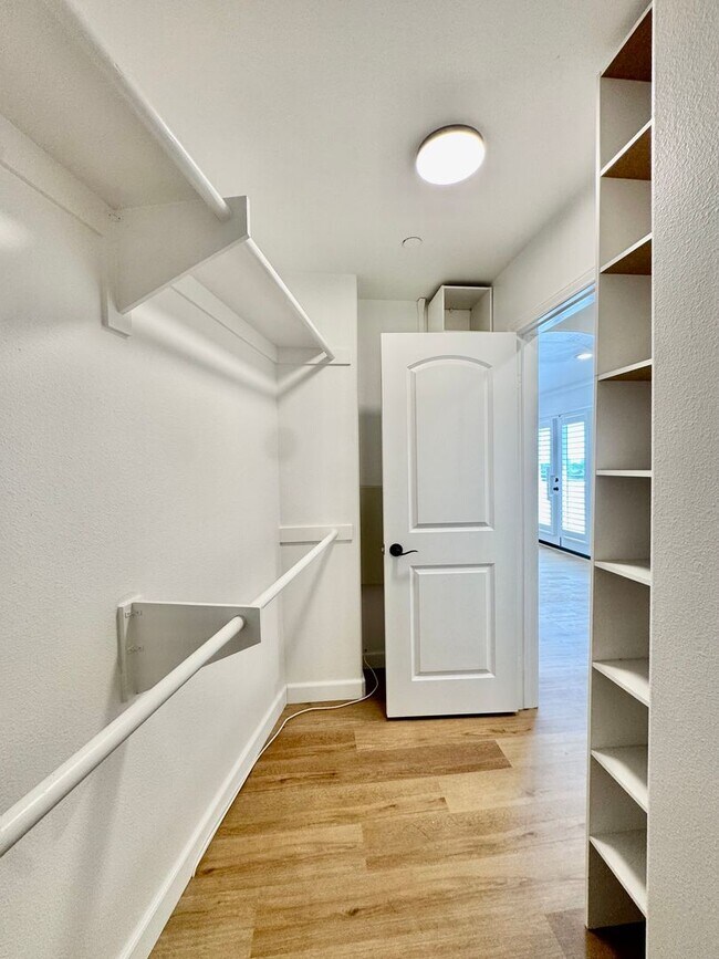 Building Photo - Beautifully Remodel Townhouse with AC & Two Car Garage!