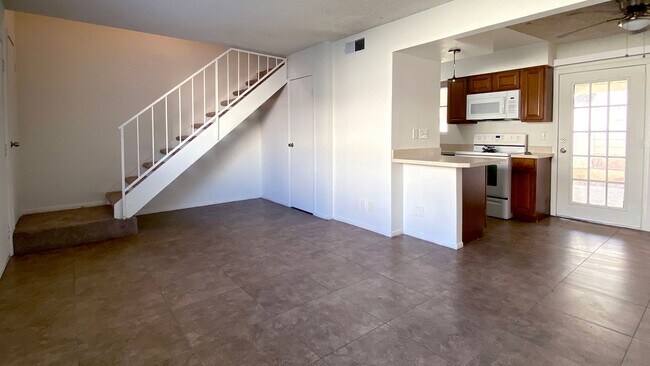 Building Photo - Great 3 bedroom and 1.5 bath townhouse with a small yard and 2 car garage.