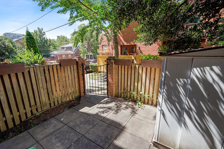 Gated patio with storage at right - 1140 N Taylor St