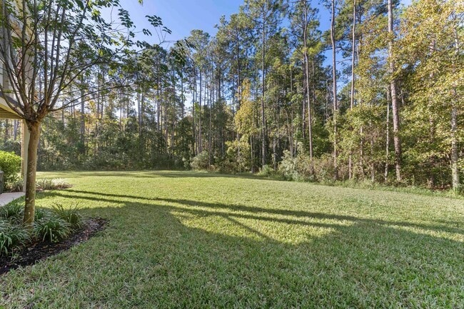 Building Photo - Introducing a captivating 3-story townhome...