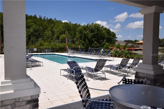 Building Photo - Like New 4/3 Townhome in Gated Community W/ Community Pool