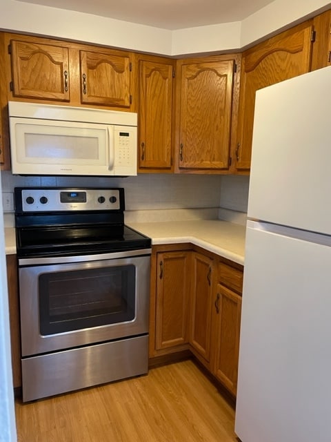 Kitchen with new refrigerator - 2422 Sycamore Ln