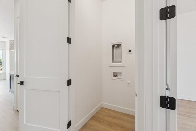 Building Photo - Bright. Clean. Calm. Your Elevated One-Bed...