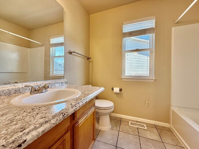 Building Photo - Spacious 4-Bedroom Home with Main level Li...