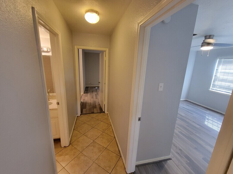 Hallway to bedrooms - 12247 W Village Dr