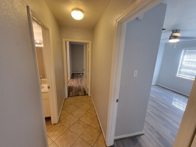 Hallway to bedrooms - 12247 W Village Dr