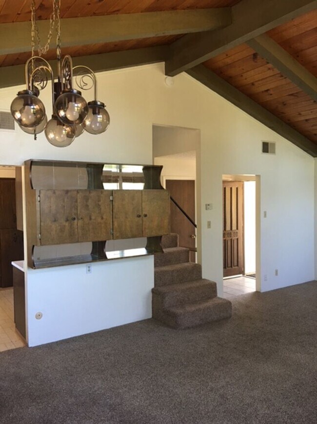 Building Photo - Downtown home with loft and exposed beam ceilings.