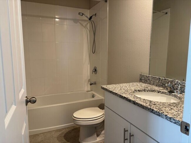 Building Photo - Like-New 4 Bedroom 3 Bath with Pond View & Two Living Spaces — Minutes to South Lake Nona