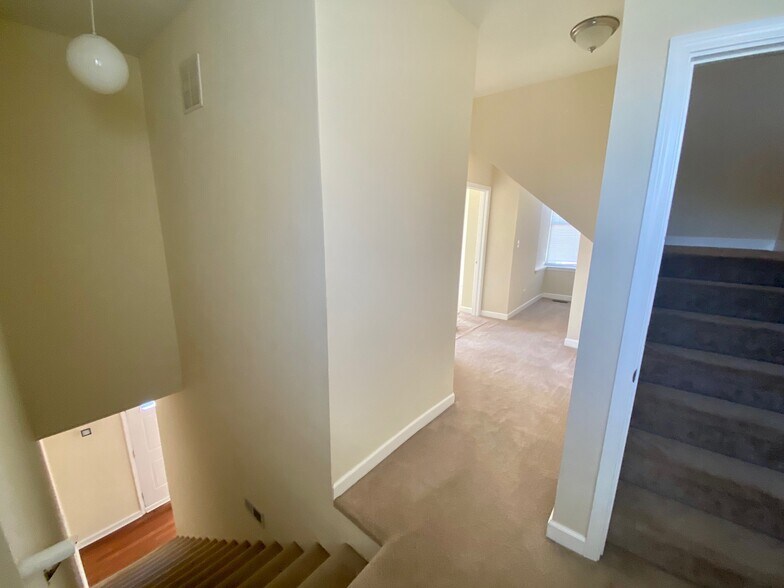 Upstairs hallway and staircase to third floor - 1152 W 19th Pl