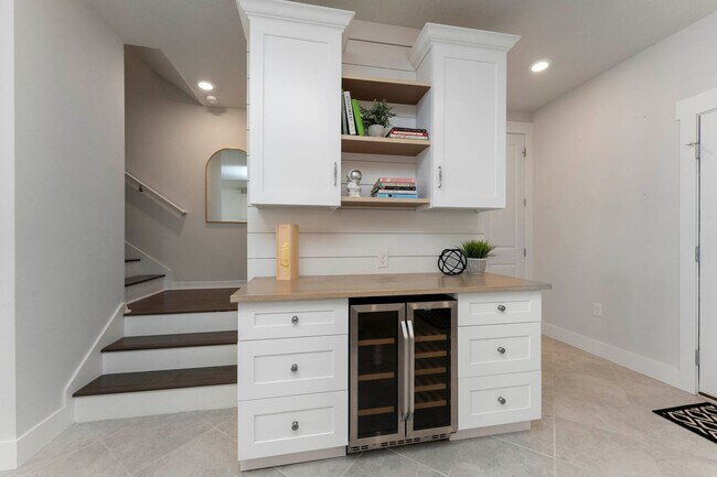 Building Photo - Introducing a captivating 3-story townhome...