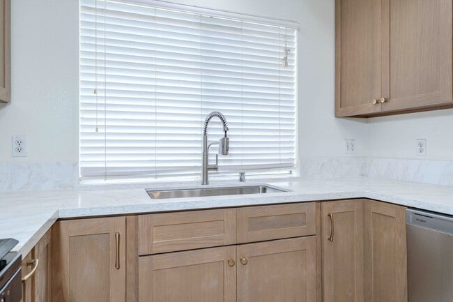 Building Photo - Gated Townhome with Updated Kitchen and Private Backyard