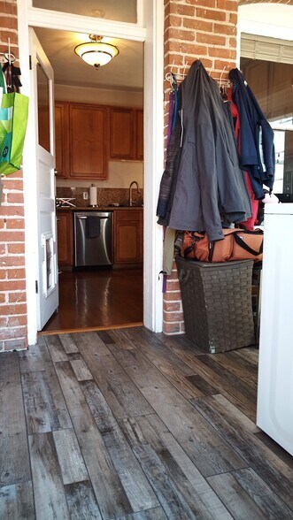 Mudroom to kitchen before updated floors - 2415 N Vine St