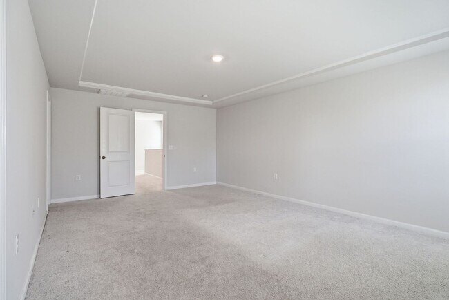 Building Photo - Upgraded 3BR Townhome in Wake Forest | Open Layout, Garage & Resort-Style Amenities