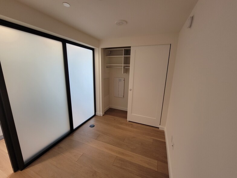 Bedroom with modern sliding doors - 450 S Main St