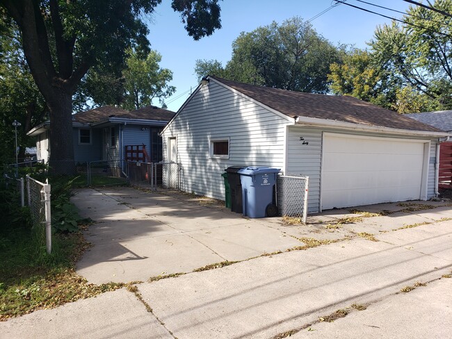 Garage for two cars plus parking for a third. - 1060 21st Ave SE