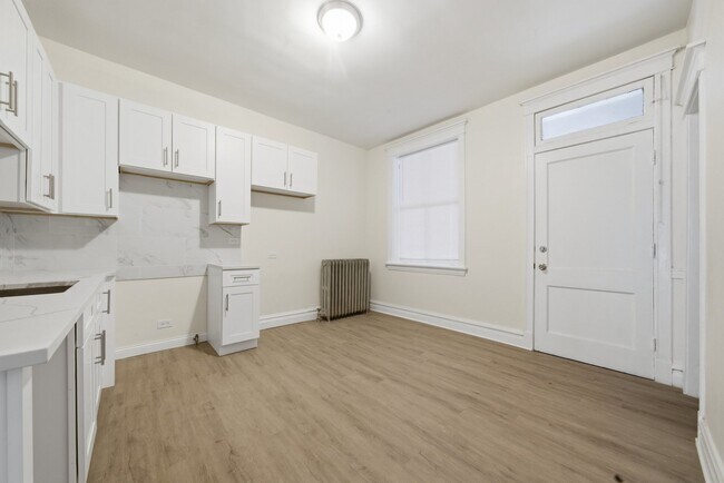 Building Photo - 7442 S Langley Ave