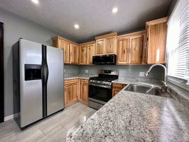 Building Photo - DEPOSIT MOVES YOU IN! No rent due until Au...