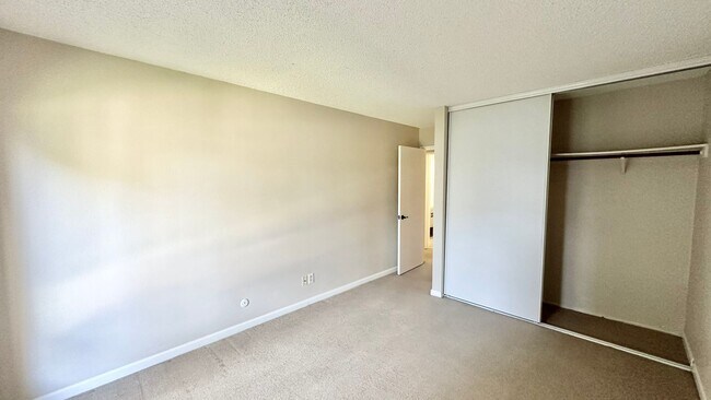Building Photo - Lovely and Spacious Condo with a Water/Lagoon View and Resort Style Amenities!
