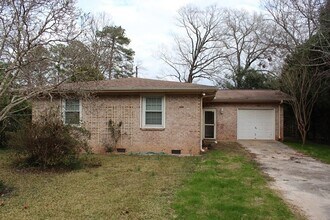 Building Photo - Welcome to this beautiful brick home nestl...
