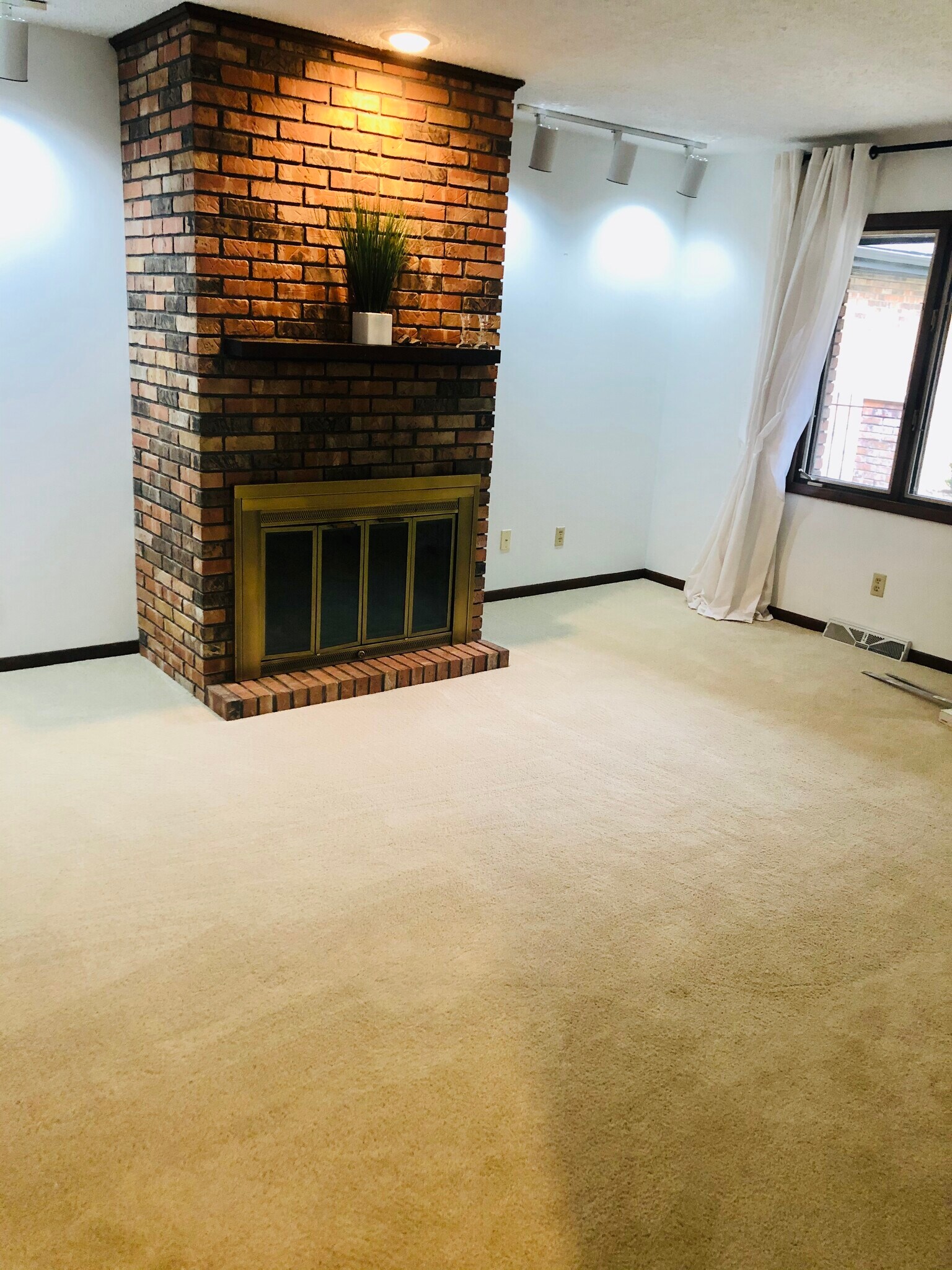Family room with wood burning fireplace - 2911 Interlacken Dr