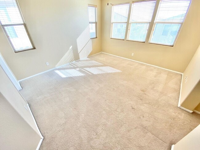 Building Photo - THIS SPACIOUS RESIDENCE FEATURES 4 BEDROOM...
