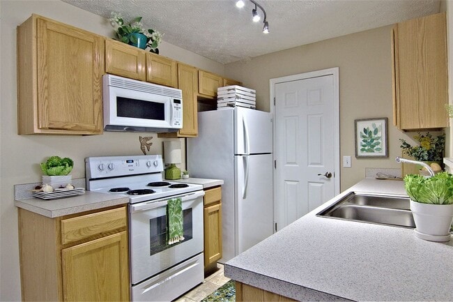 Modern kitchen with wooden cabinetry - Cumberland Links