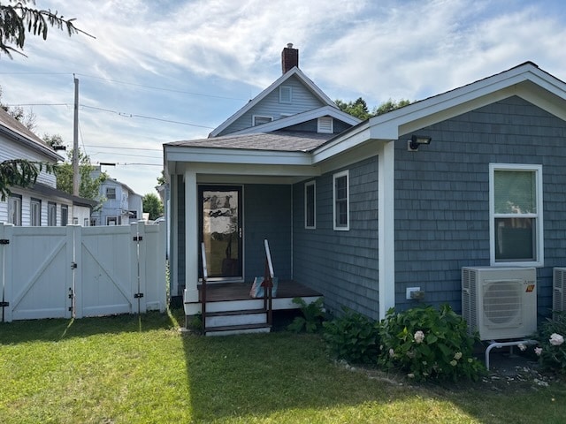 A reverse shot of the back yard. The small porch enters into the dining room. - 52 Rose St
