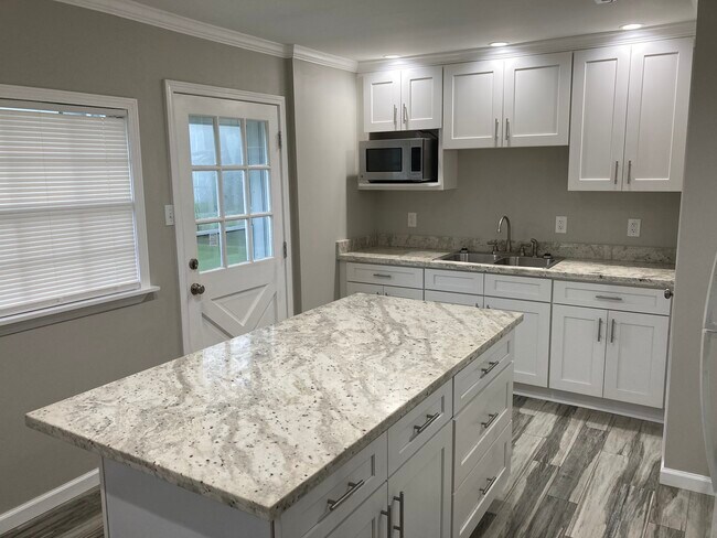 Island has an overhang to eliminate the need for a kitchen table - 4443 Jacqueline Dr