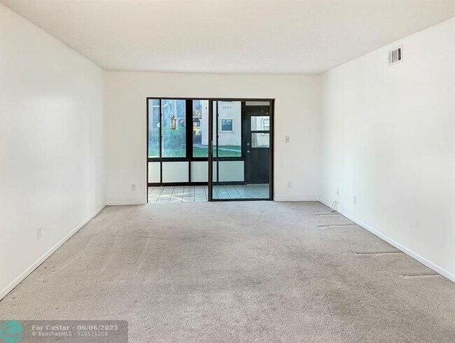 Building Photo - 6090 N Sabal Palm Blvd