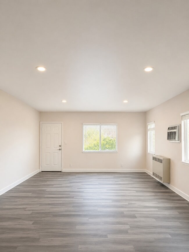 Open Living room facing front door. - 4534 Edgewood Pl