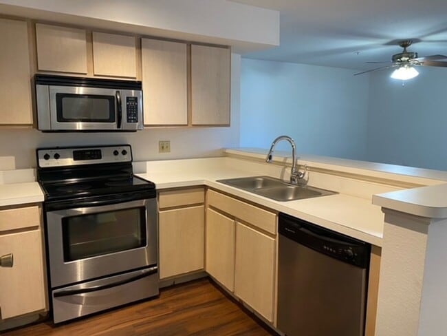 Building Photo - Stylish 2 Bed, 2 Bath Condo with New Vinyl...