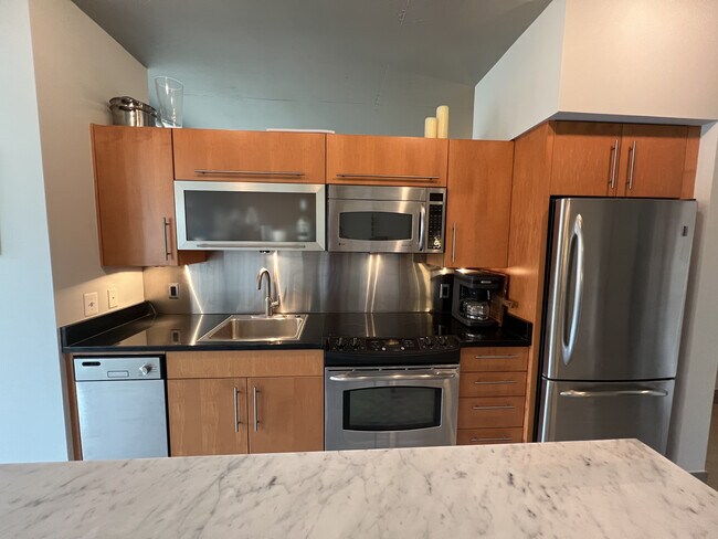 Industrial Kitchen with Stainless Steel Appliances - 1133 14th St NW