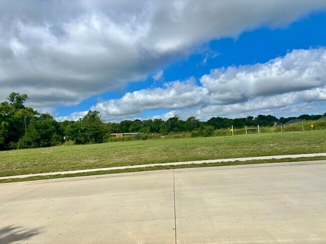 Building Photo - COMING SOON! Greenbelt Views & Giant Yard — Freshly Painted 4BR in Golden Pond