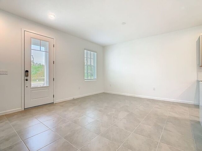 Building Photo - New Luxury Townhome in Celebration with All porcelain tiled floors. Island Village new construction