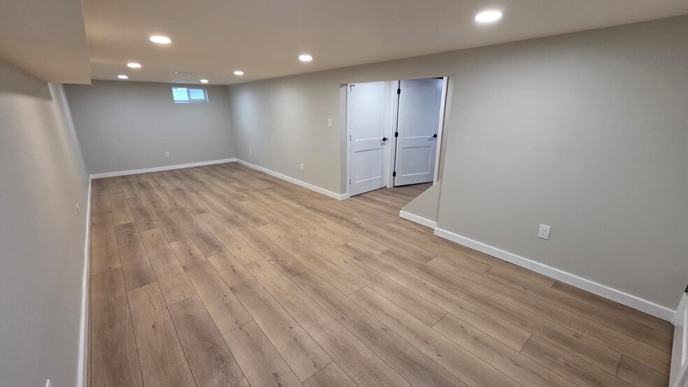 ideal for a media room, playroom, home gym, or additional lounge area. - 604 Holly Ln