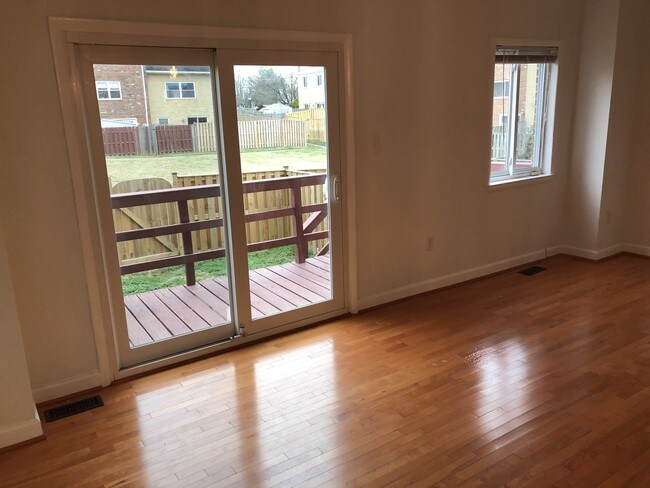 Living Room w/exit to deck & backyard - 7415 Rhondda Dr