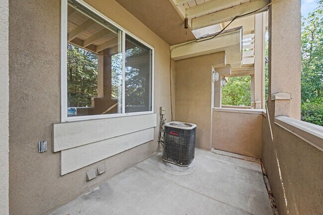 Building Photo - Beautiful 2BR Townhome in Gated Community with 2-Car Garage