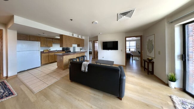 Living Room/Kitchen - Collegiate Campus Apartments