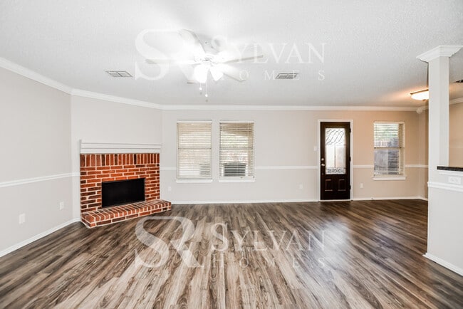 Building Photo - The living is easy in this gorgeous 4BR, 2.5BA brick home