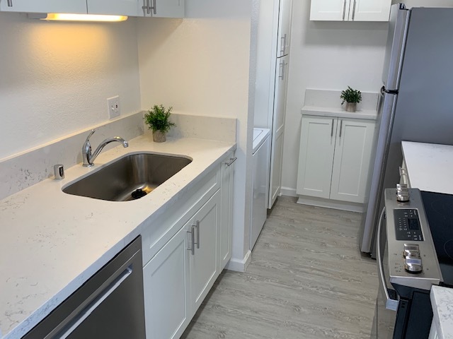 Brand new cabinets, quartz countertops, sink, and disposal - 2100 Date St