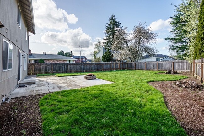 Building Photo - Recently Updated with Wood Laminate Flooring and Fresh Paint