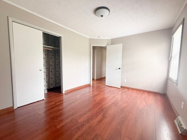 Building Photo - Spacious 3-Bedroom Home with Huge Yard, Covered Porches & Storage Building