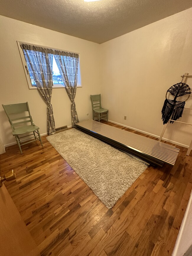 Bedroom 3 on main level (that’s acoustic wood paneling for the basement that will be finished by 1/2 - 1214 Lincolnwood Rd