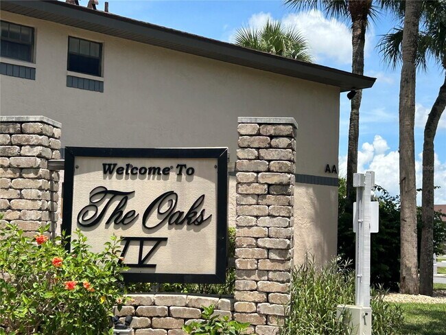 Building Photo - "2-Bed, 2-Bath Condo in Oaks IV - Your Cozy 899 Sq. Ft. Haven Awaits!"