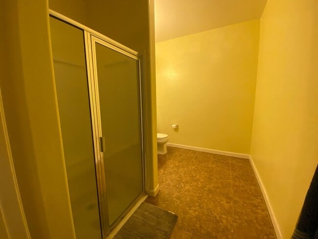 Building Photo - First Floor Unit with 2 Car Garage with Di...