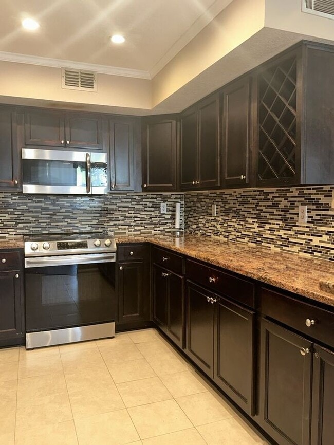 Building Photo - THE TRIAD TOWNHOMES IN CARROLLWOOD