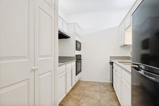 Building Photo - Spacious Dallas Condo with Unbeatable Storage, Private Patio & Carport