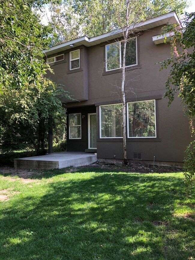 Private backyard with patio on Emigration Creek - 1147 E Garfield Ave